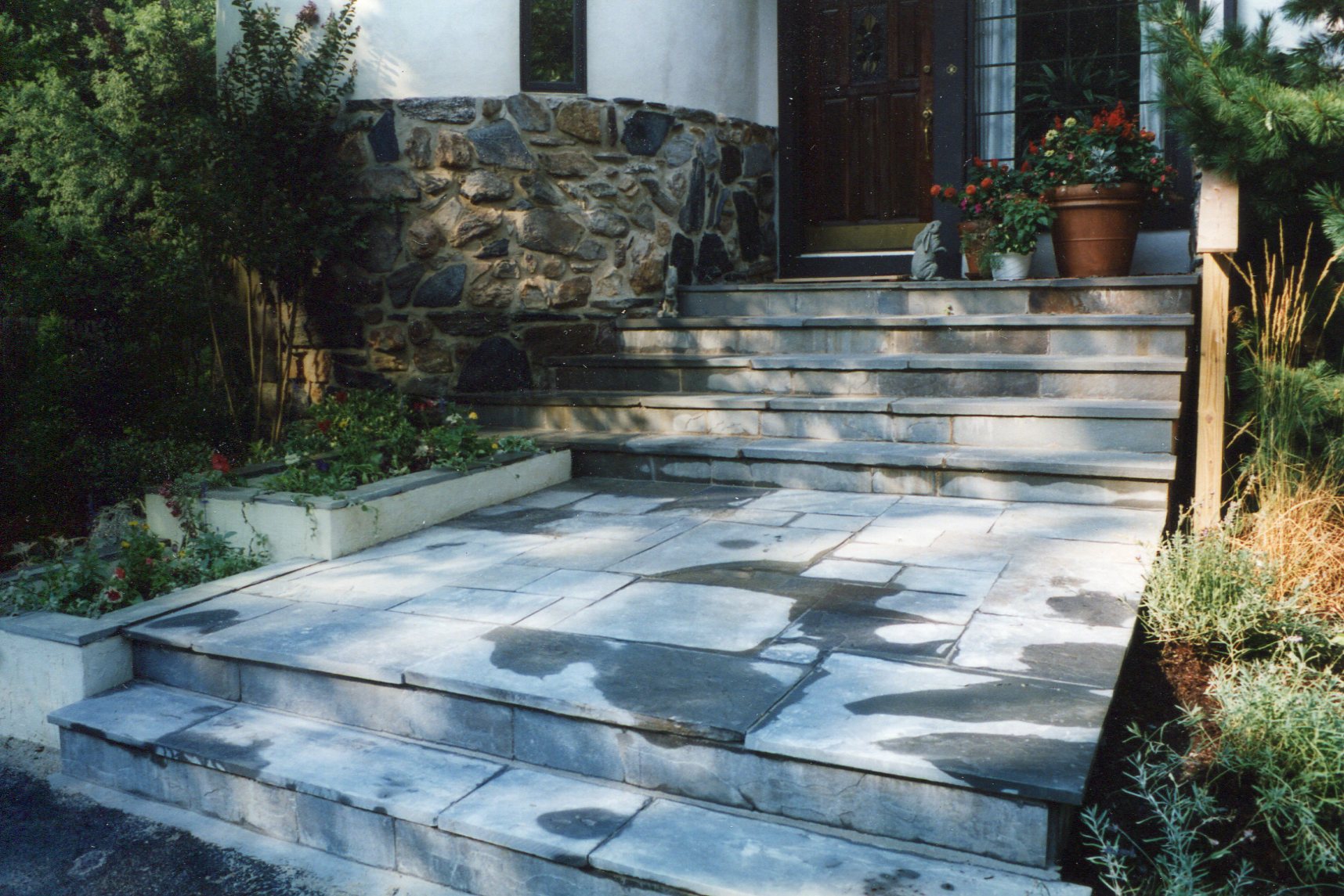 Flagstone entry with planters